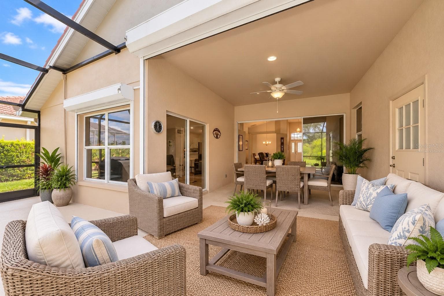 Virtually Staged Roll down storm shutters on deep covered lanai. - 5113 FLAGSTONE DR, SARASOTA