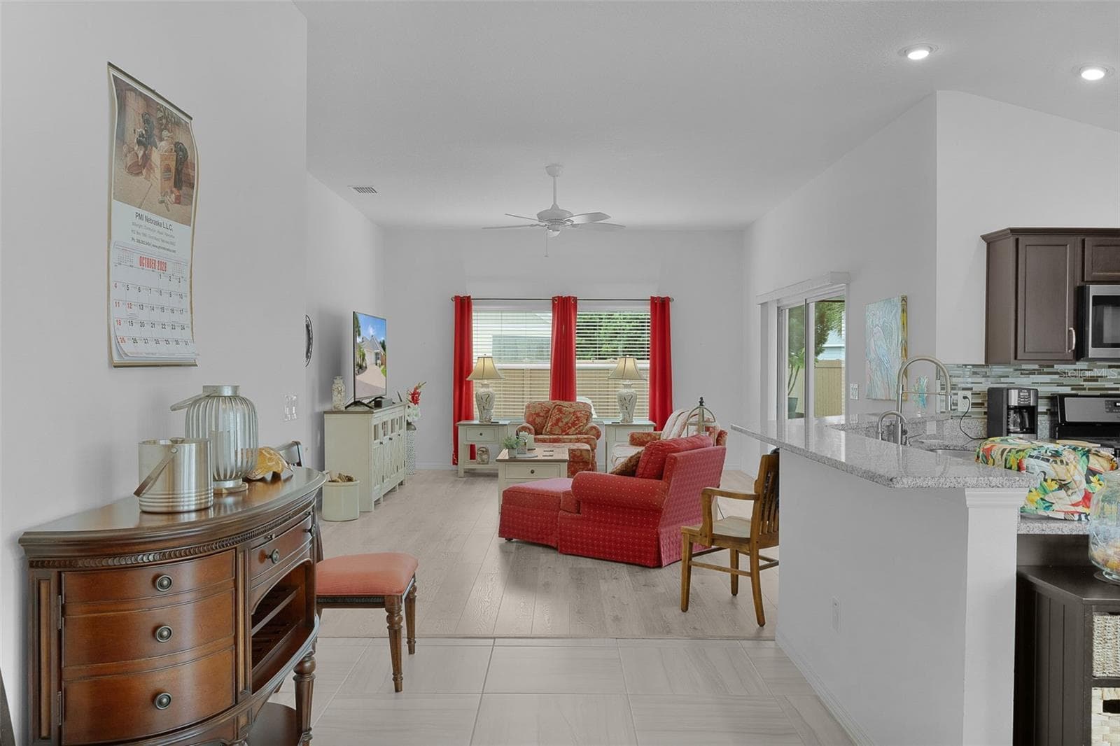 There's a breakfast bar with granite countertops - 3144 ROBBS RD, THE VILLAGES