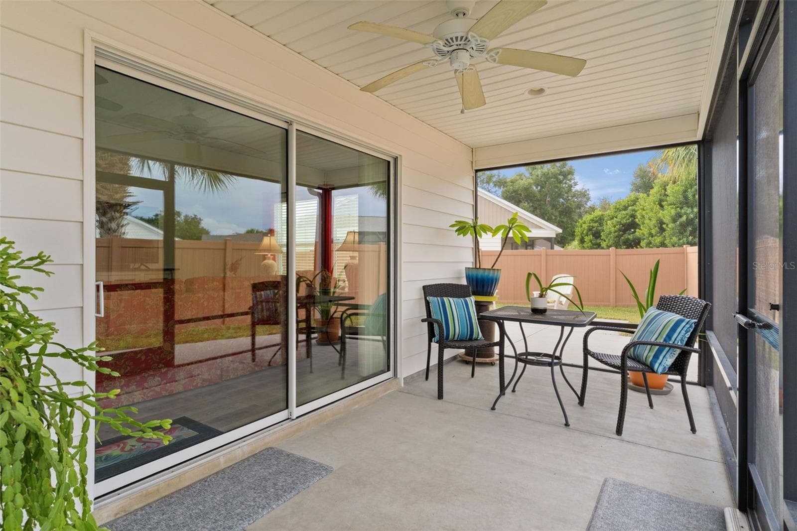 Covered, screen lanai leads to the large patio area - 3144 ROBBS RD, THE VILLAGES