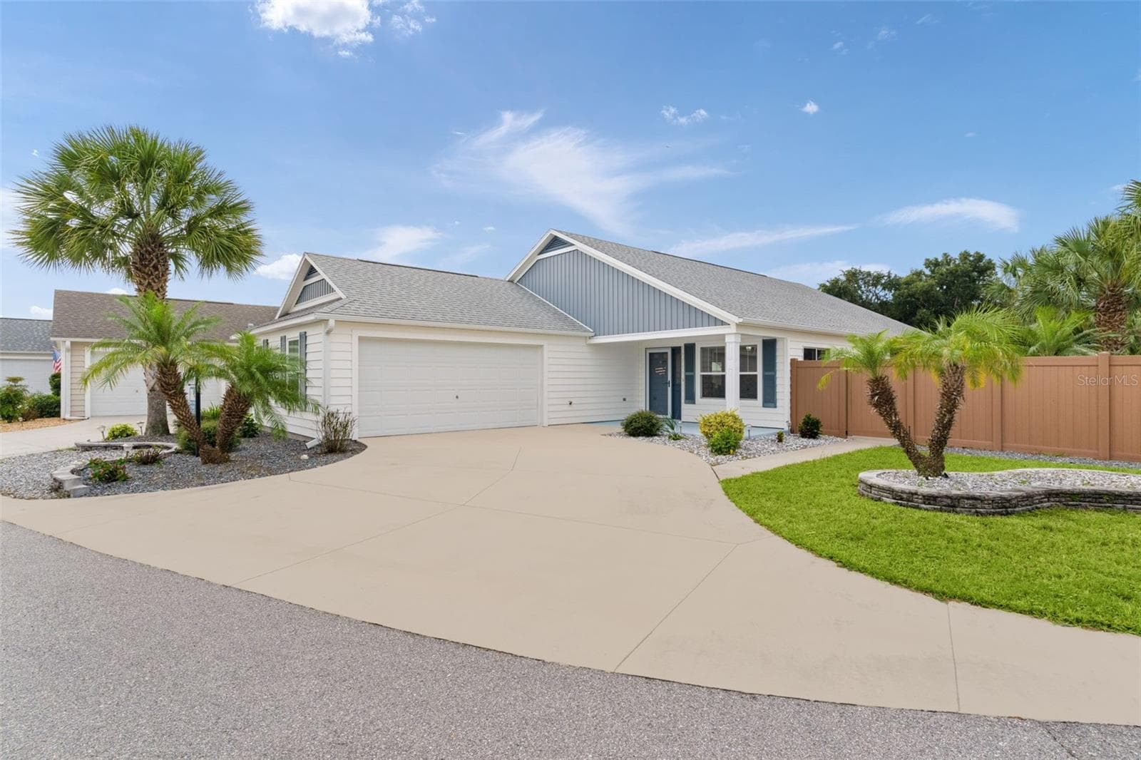 The 24x22 two-car garage has lots of room for toys & driveway ideal for guest parking or parties! - 3144 ROBBS RD, THE VILLAGES