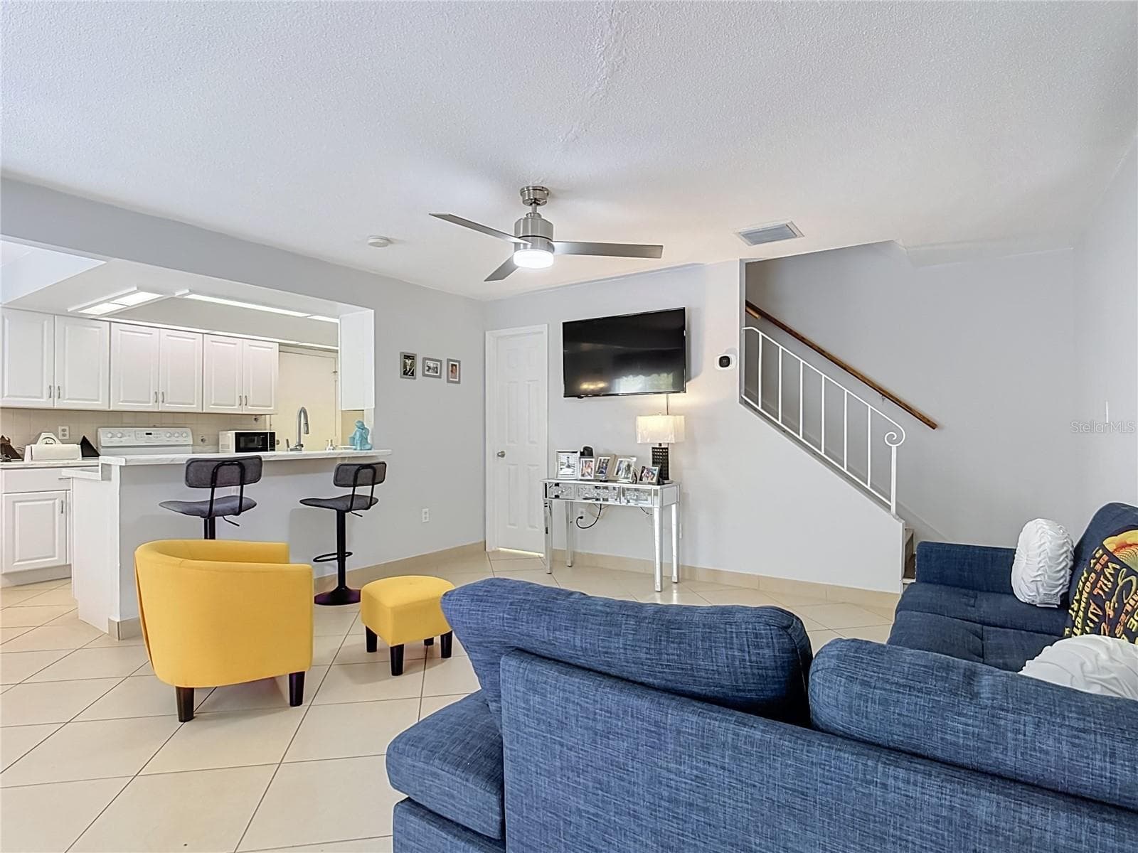 Living area with access upstairs - 1106 SPRING MEADOW DR, KISSIMMEE