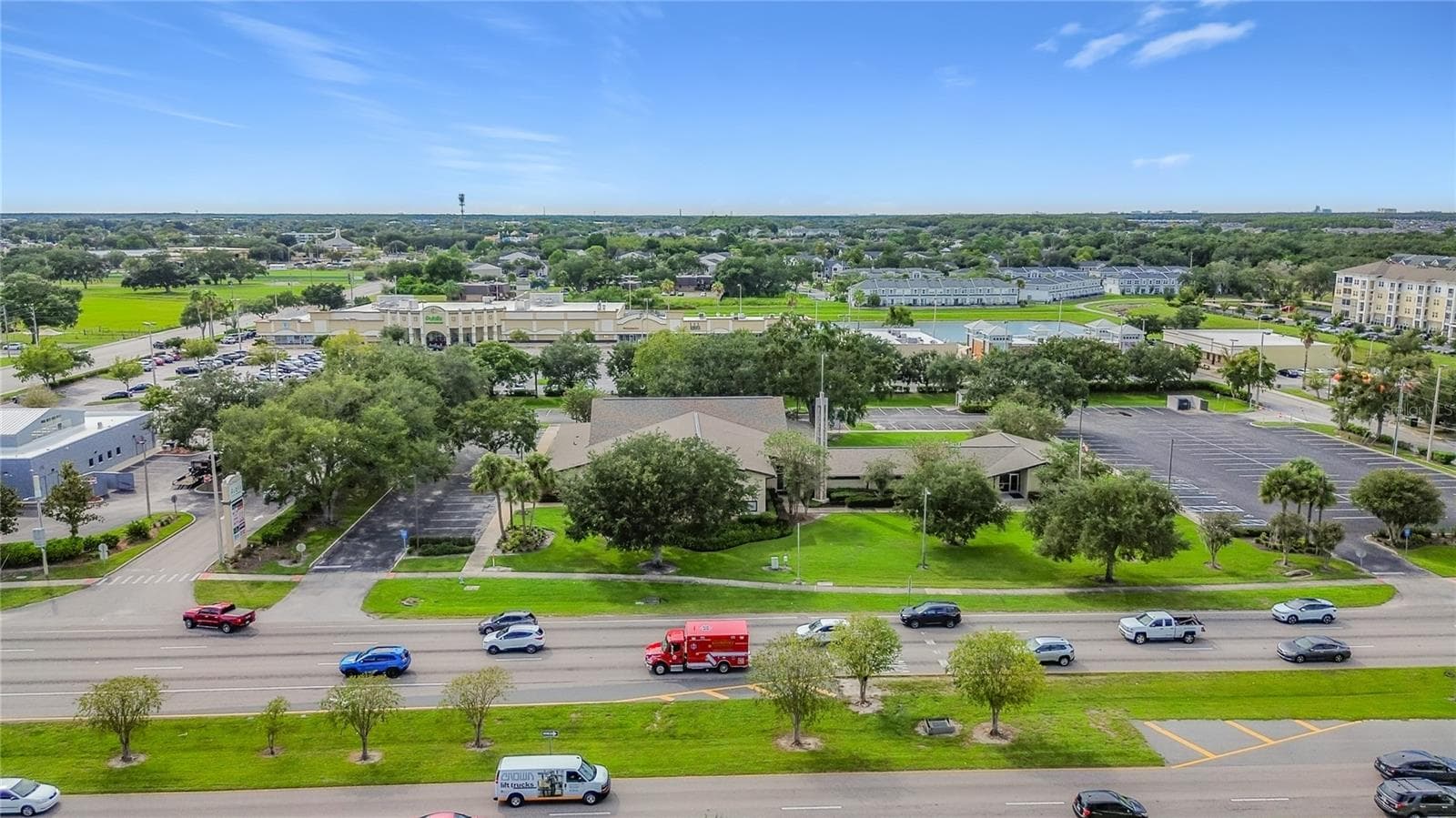 Surrounding businesses and green spaces. - 1106 SPRING MEADOW DR, KISSIMMEE