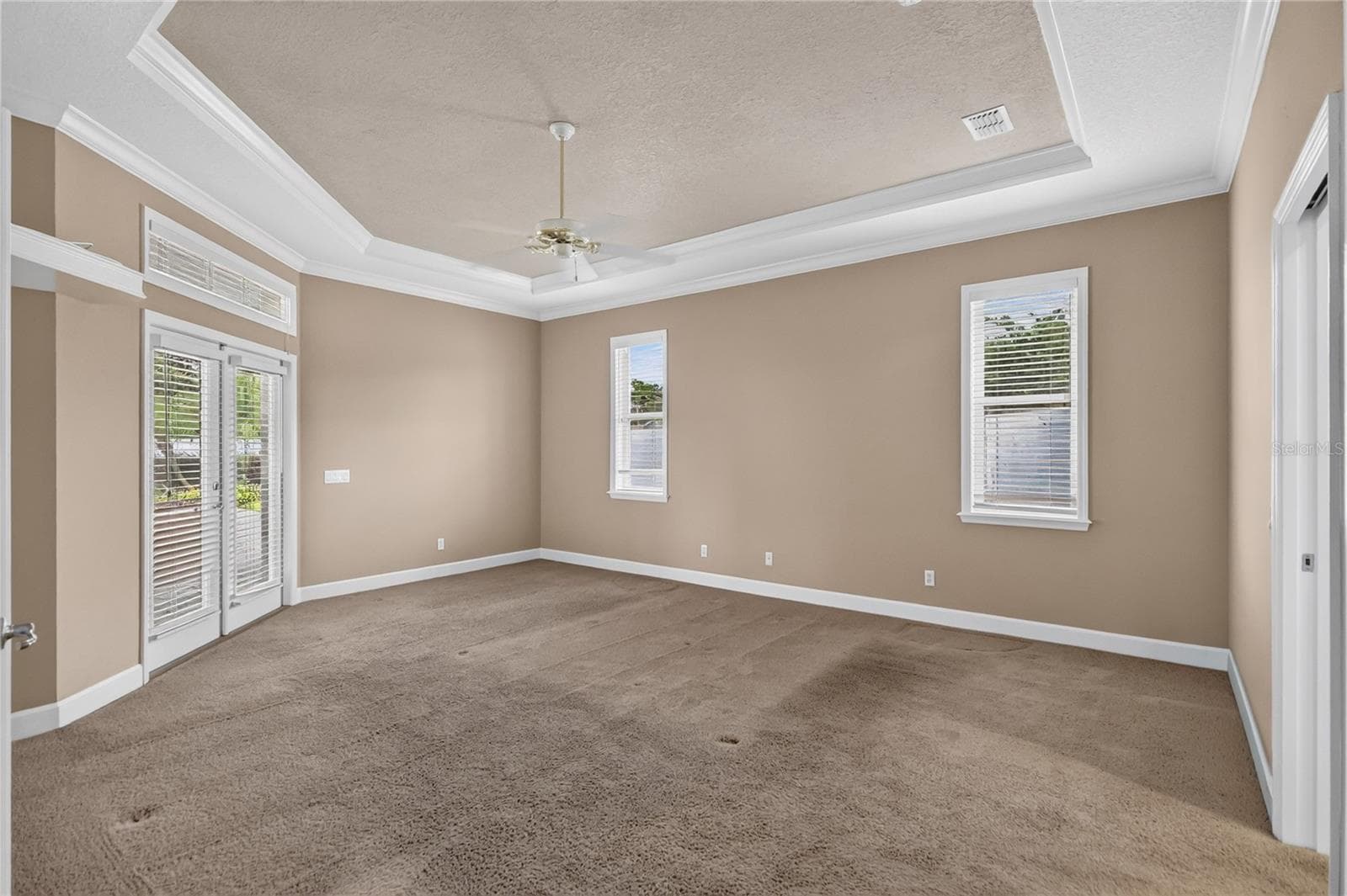 Master Bedroom with French Doors out to Lania - 734 HIGHLANDS PLACE BLVD, LAKELAND