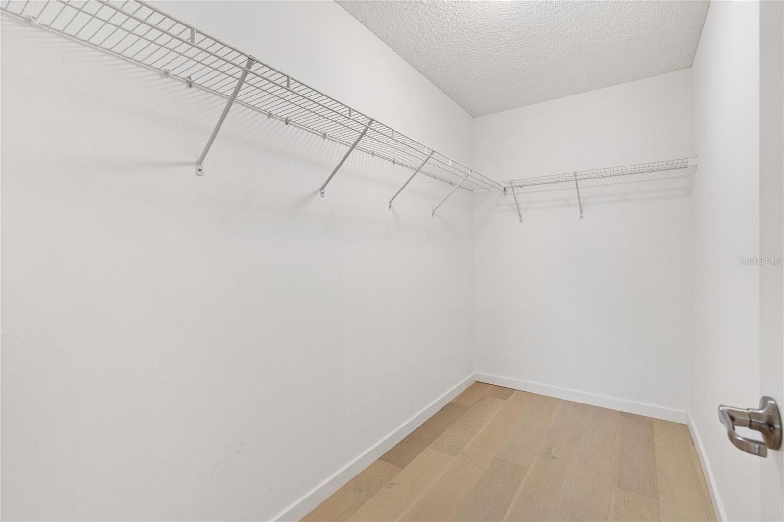 Primary walk-in closet - 9595 SE 171ST ARGYLL ST, THE VILLAGES