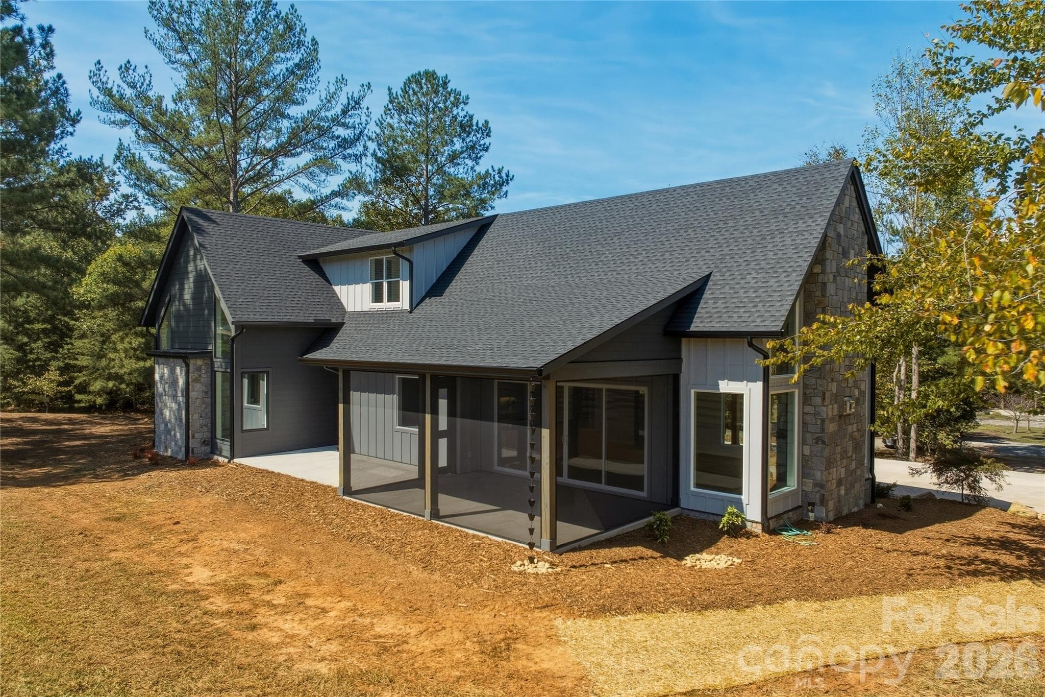 The back patio is screened and there are charming rain chains instead of traditional gutter downspouts along the front and rear porches as well as by the garage. - 2303 Paddock Circle, Morganton