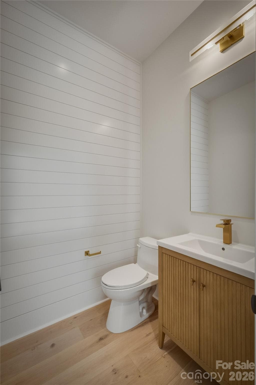 The final room on the main level is this powder room which also has a feature wall that dresses it up for your guests. - 2303 Paddock Circle, Morganton