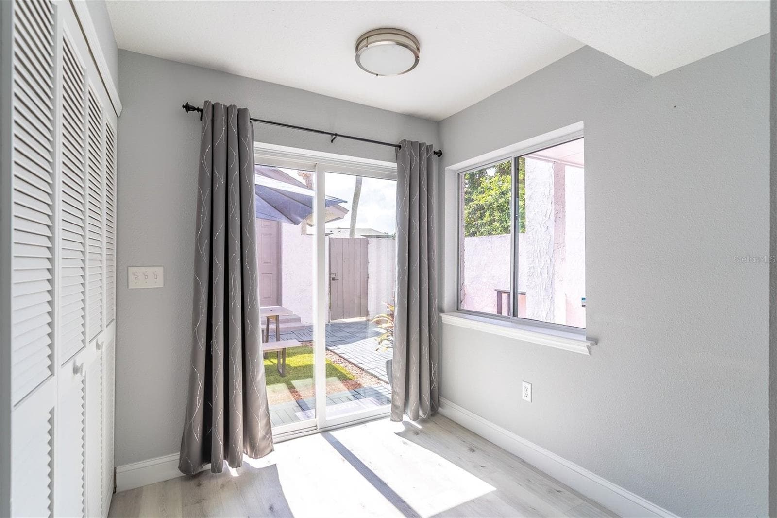 Indoor-outdoor flow done right. Low-E sliding glass doors open directly to your 345 sqft private courtyard - 139 OLIVE TREE CIR, ALTAMONTE SPRINGS
