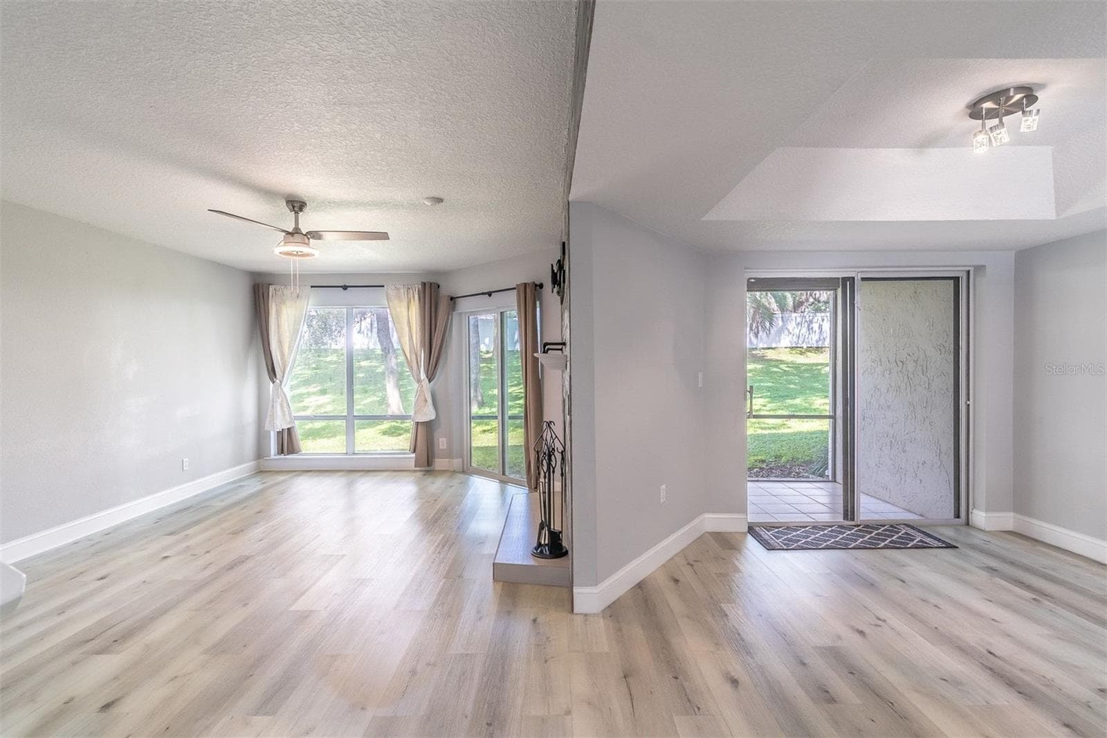 THE leveled up the living space—literally. The former sunken living room was raised to create a seamless, open-concept flow. - 139 OLIVE TREE CIR, ALTAMONTE SPRINGS