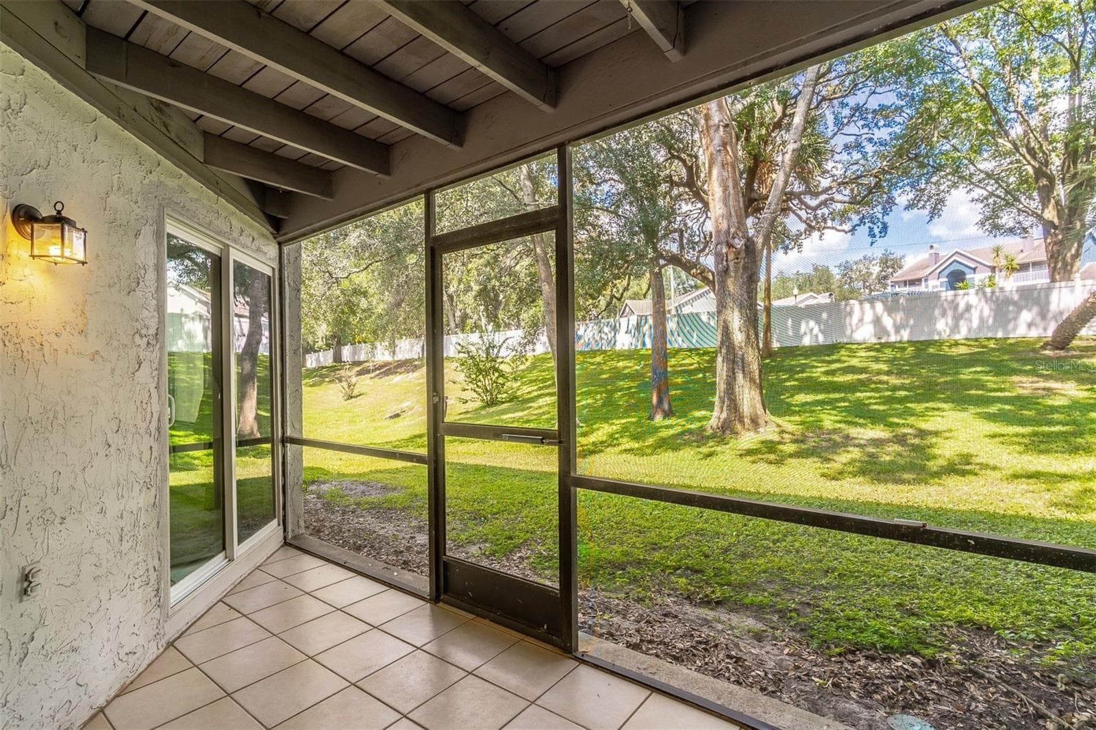 2nd access to the screened-in rear patio from the living room - 139 OLIVE TREE CIR, ALTAMONTE SPRINGS