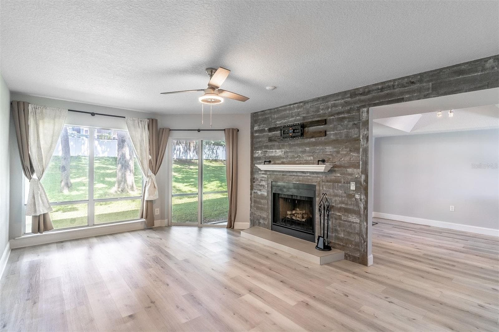 Living room open to the dining room.CHARACTER IN EVERY CORNER - 139 OLIVE TREE CIR, ALTAMONTE SPRINGS