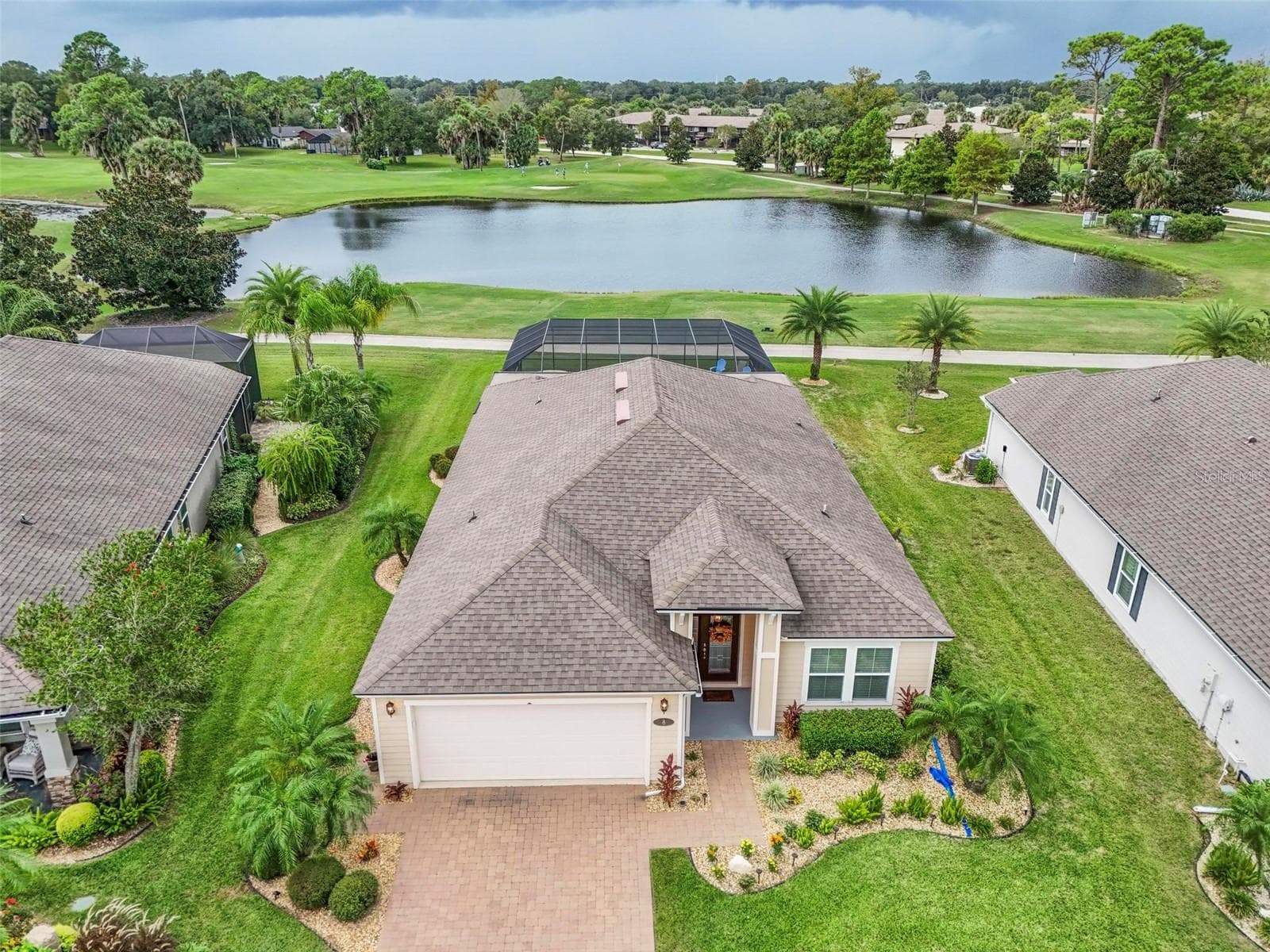 Aerial view to pond and golf course - 8 COUNTRY CLUB HARBOR CIR, PALM COAST