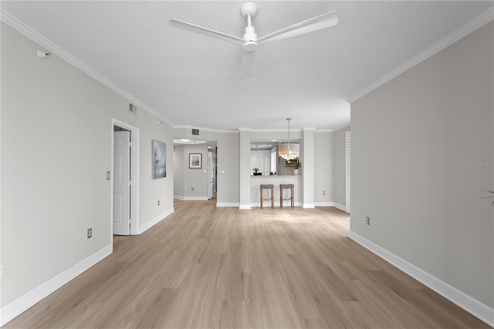 Looking Back from Veranda to Living and Dining Area - 4961 BACOPA LN S #201, ST PETERSBURG