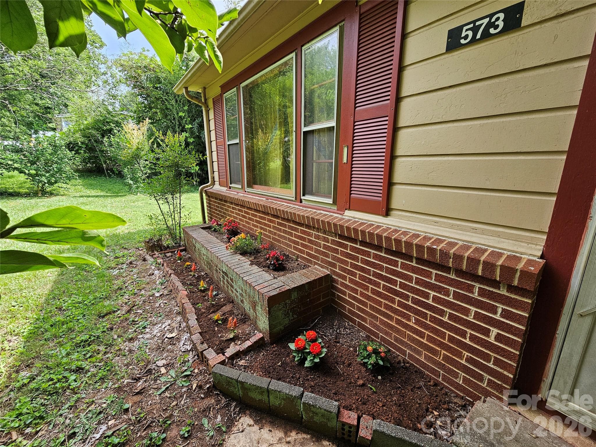 Planter box under picture window, front of house - 573 Uptons Landing Road, Marion