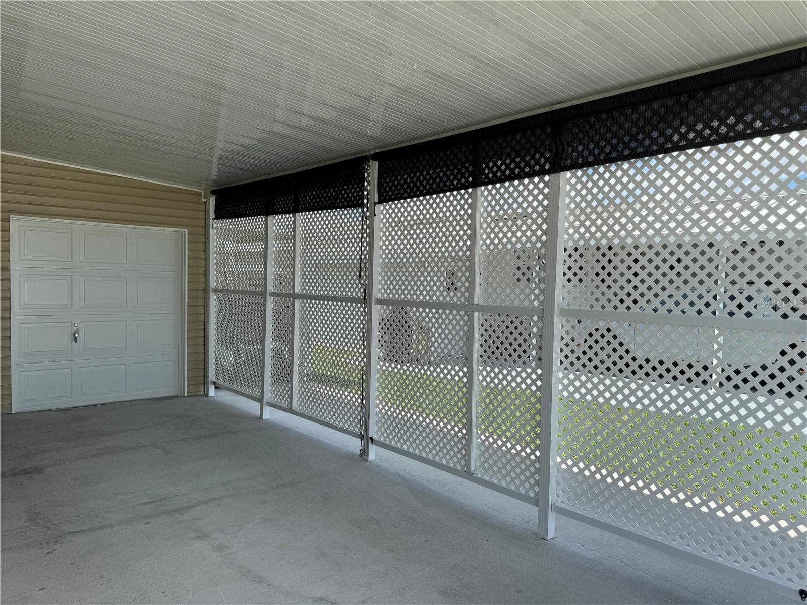 Carport with latice protection - 57 STRAPHMORE DR, HAINES CITY