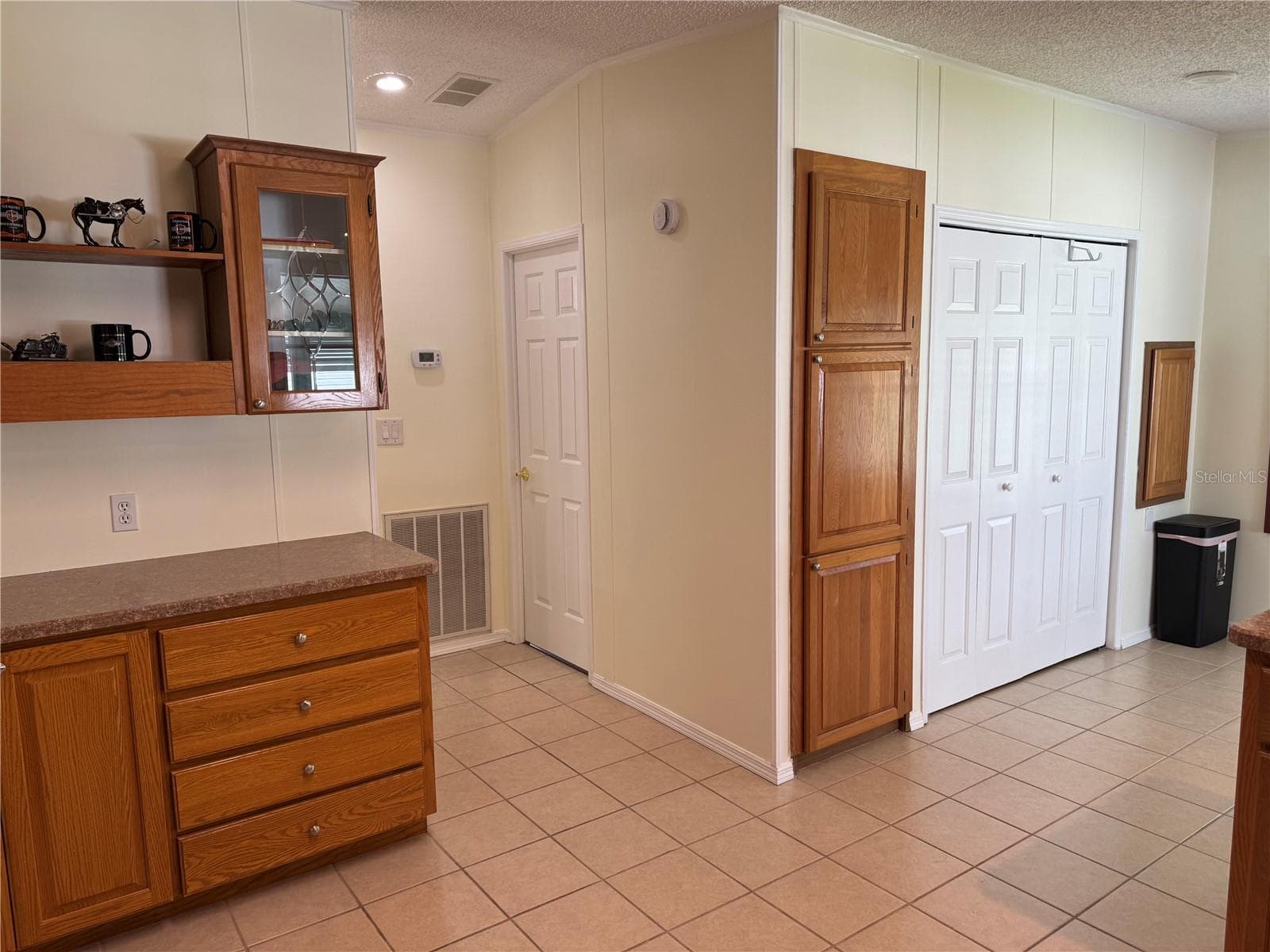 Kitchen with hall to guest bath and bed - 57 STRAPHMORE DR, HAINES CITY