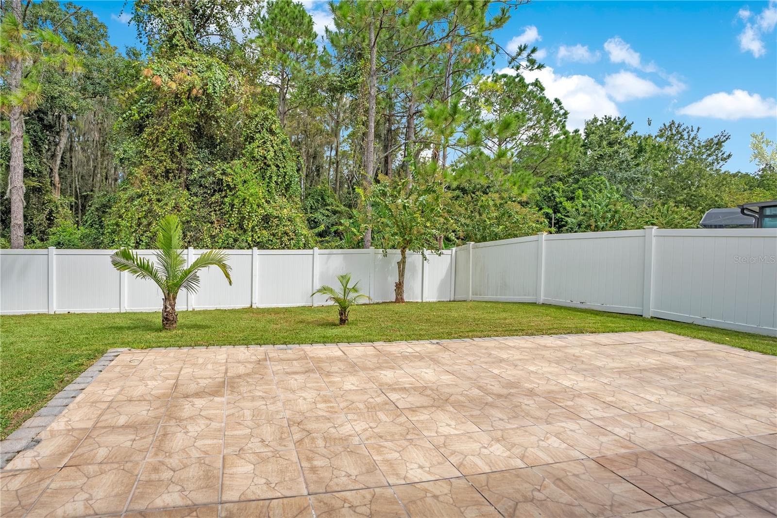 extended patio / fenced in yard - 5762 COVINGTON COVE WAY, ORLANDO