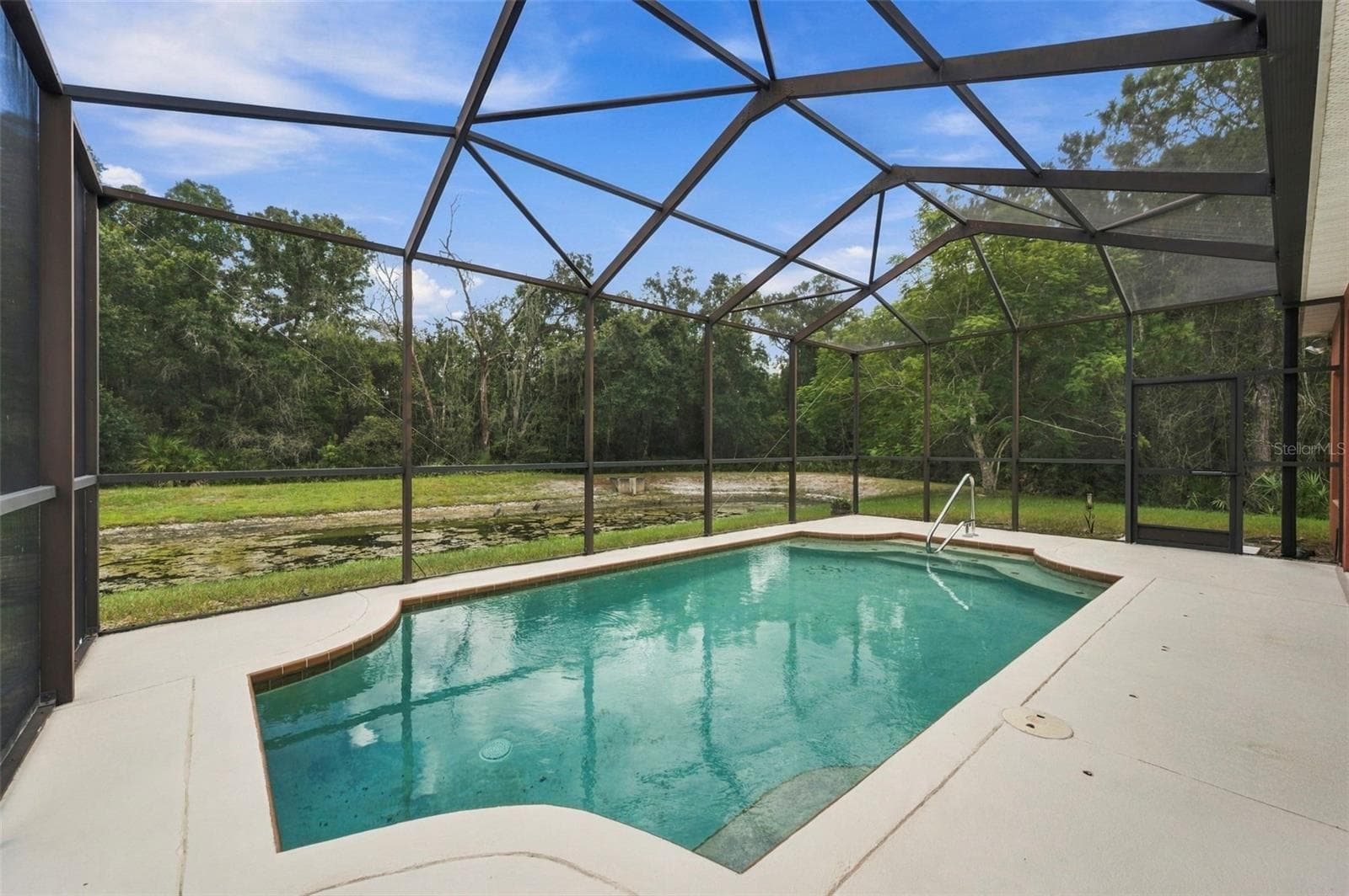 Single Family Residence at 11002 BELLE HAVEN DR, NEW PORT RICHEY, photo 2 of 100