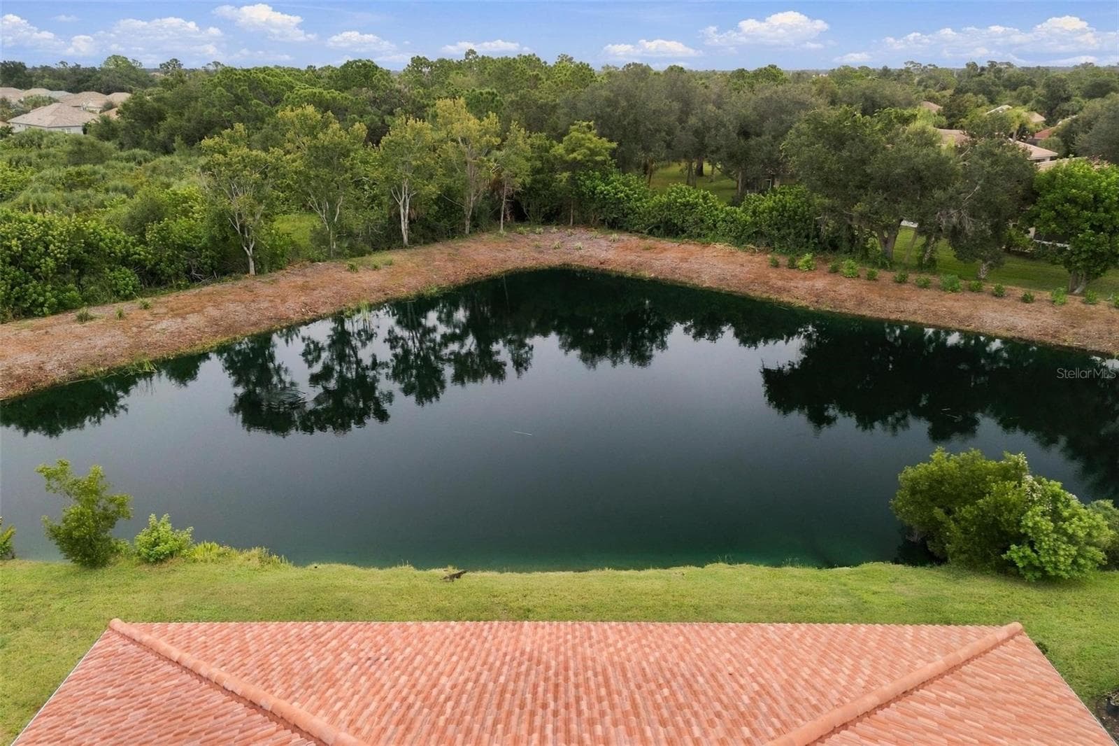 Southeastern facing pond view - 10828 LERWICK CIR, ENGLEWOOD