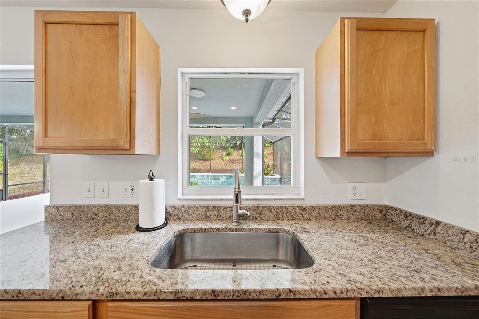 Kitchen Sink overlooking the Lanai and Pool - 6526 POMEROY CIR, ORLANDO