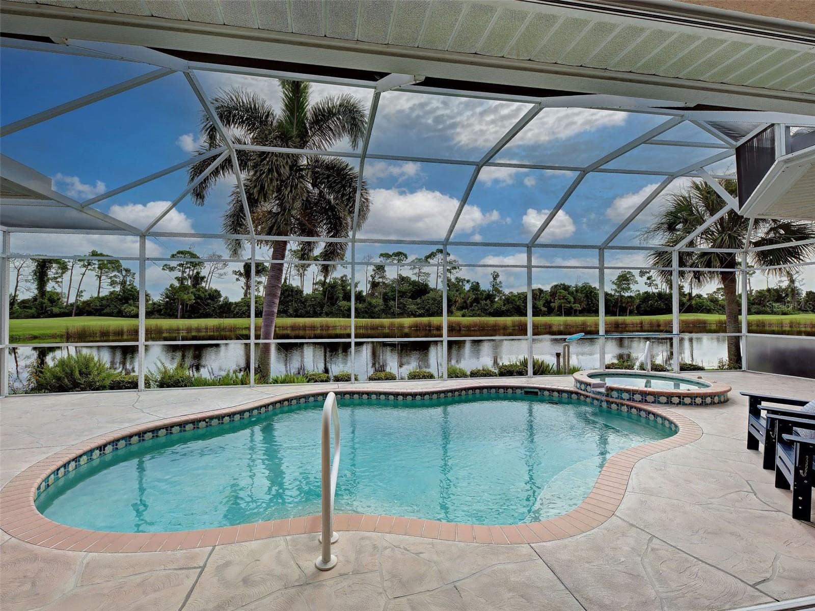 Mesmerizing lake, golf and preserve views for as far as the eye can see.  A home with this exceptional view is very rare. - 692 EGRET WALK LN, VENICE
