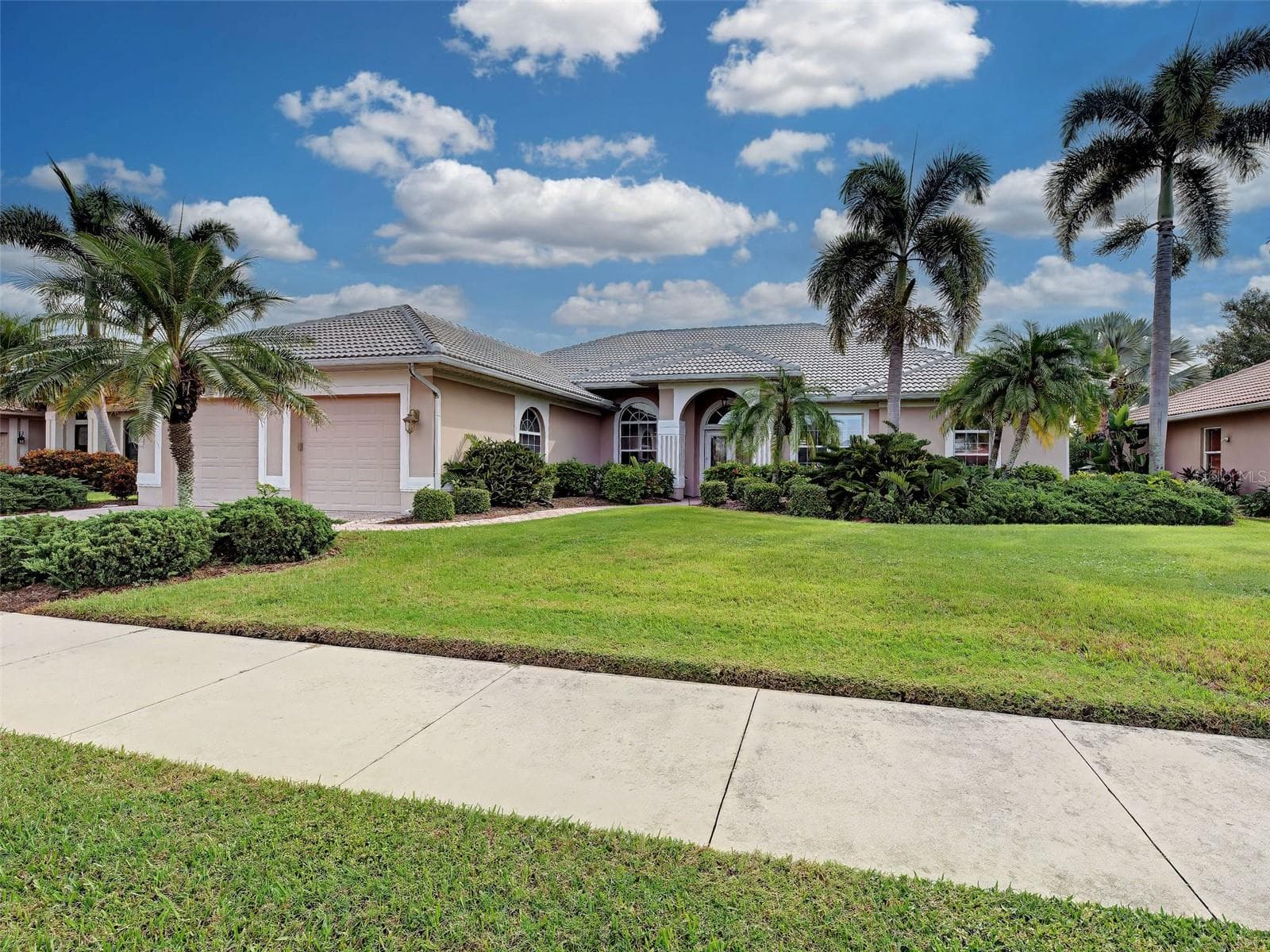 This fabulous home has large NEW TILE ROOF (2025) with transferable warranty, mature, lush landscaping, large lot and is not in a flood zone. - 692 EGRET WALK LN, VENICE