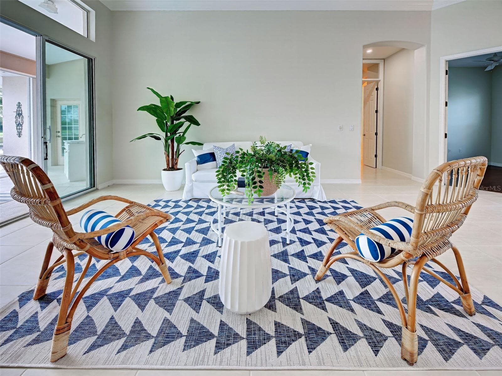 Entertain in style in the large living room which seamlessly flows to the lanai and pool area. - 692 EGRET WALK LN, VENICE