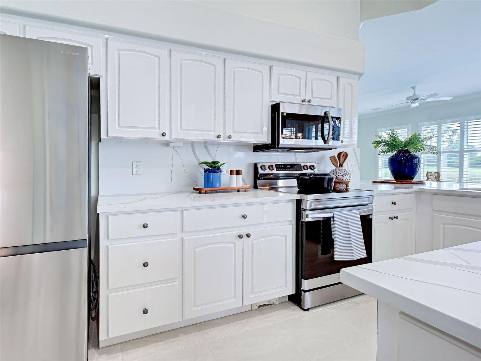Kitchen has brand-new stainless-steel appliances and so much storage. - 692 EGRET WALK LN, VENICE
