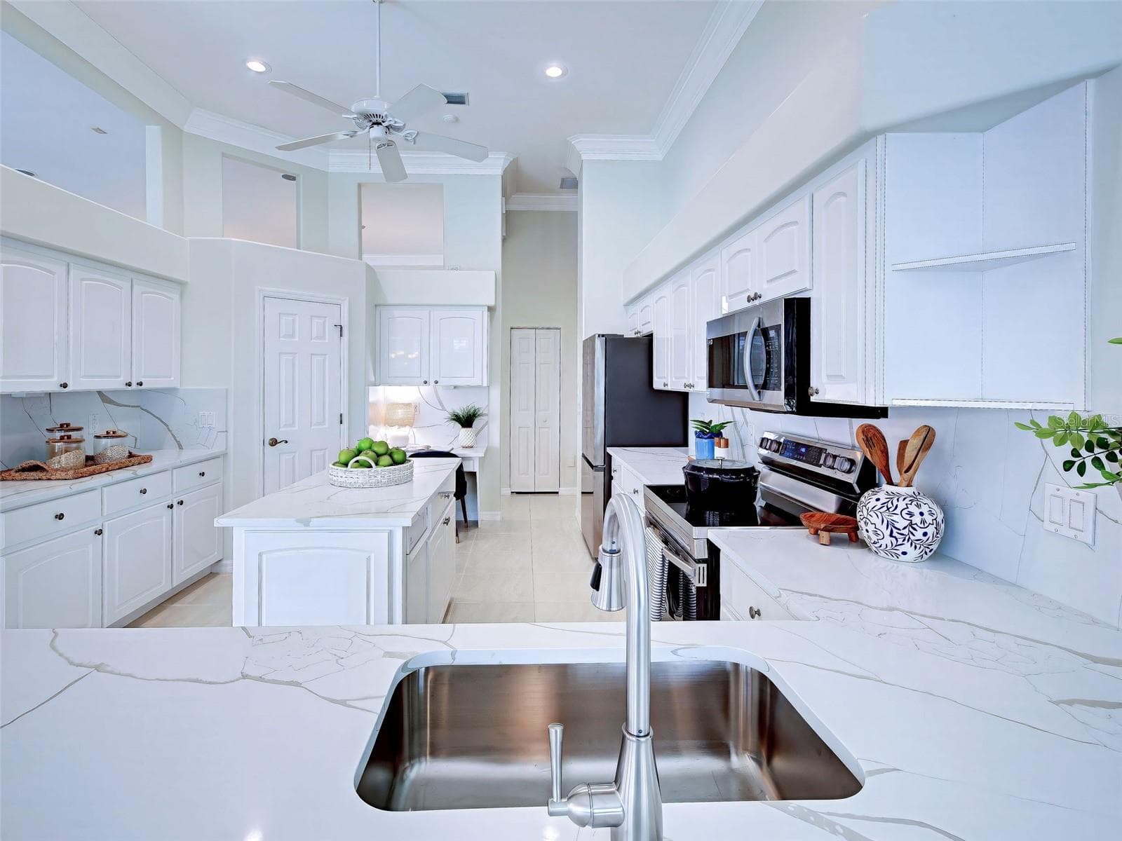 Another view of the spectacular kitchen with so much prep and storage space. - 692 EGRET WALK LN, VENICE