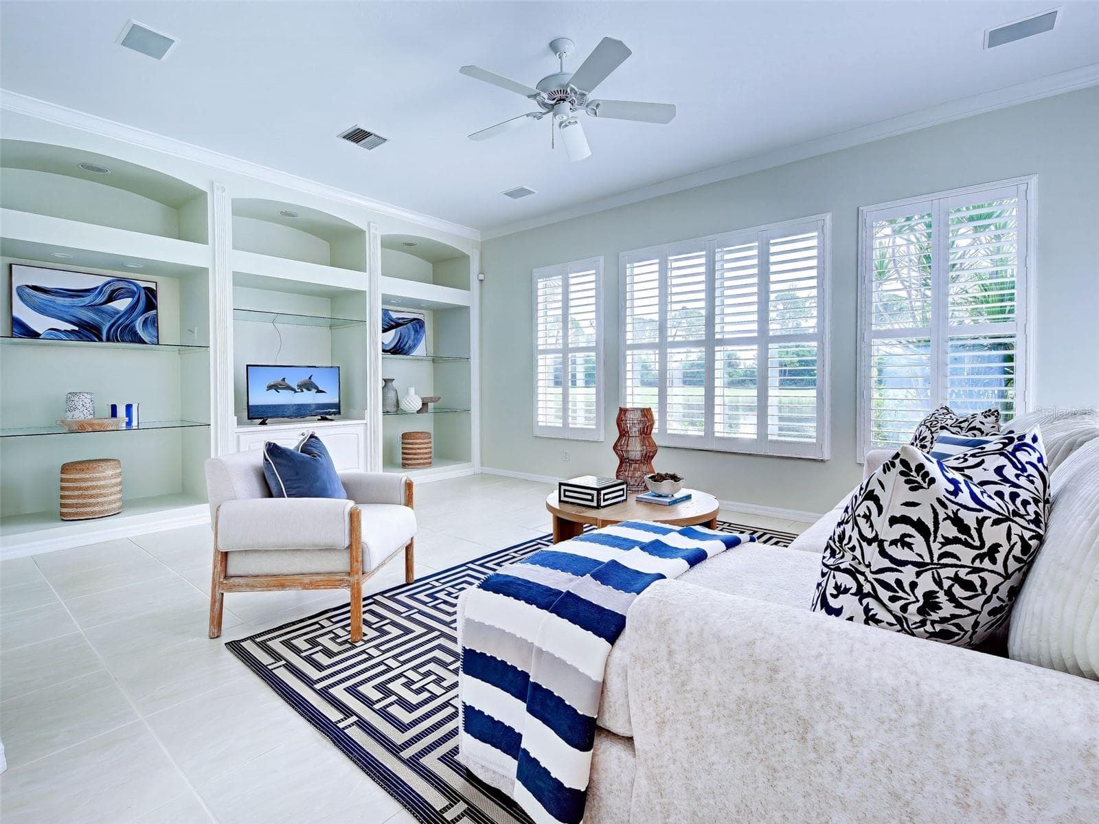Family room has high ceilings and a wall of windows so you take in the views, - 692 EGRET WALK LN, VENICE