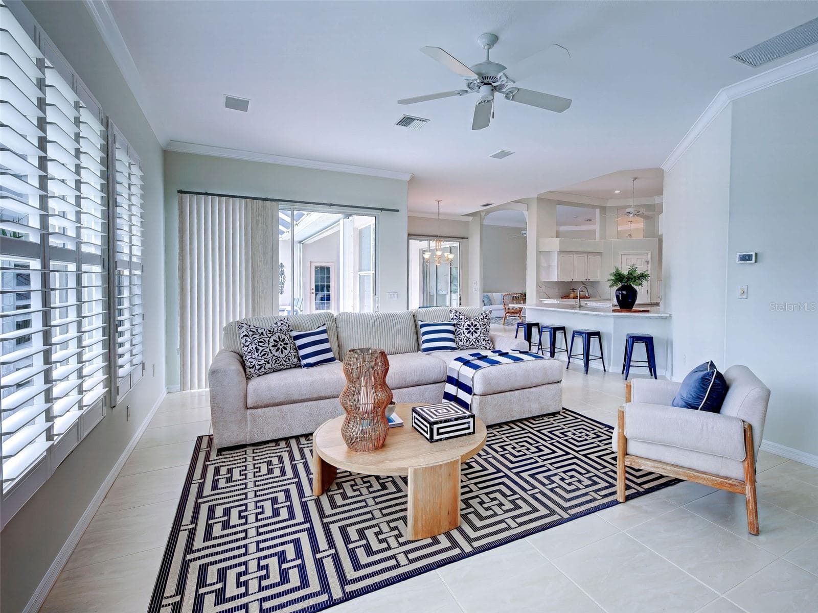 Family room with lanai sliders and easy access to the stunning kitchen. - 692 EGRET WALK LN, VENICE