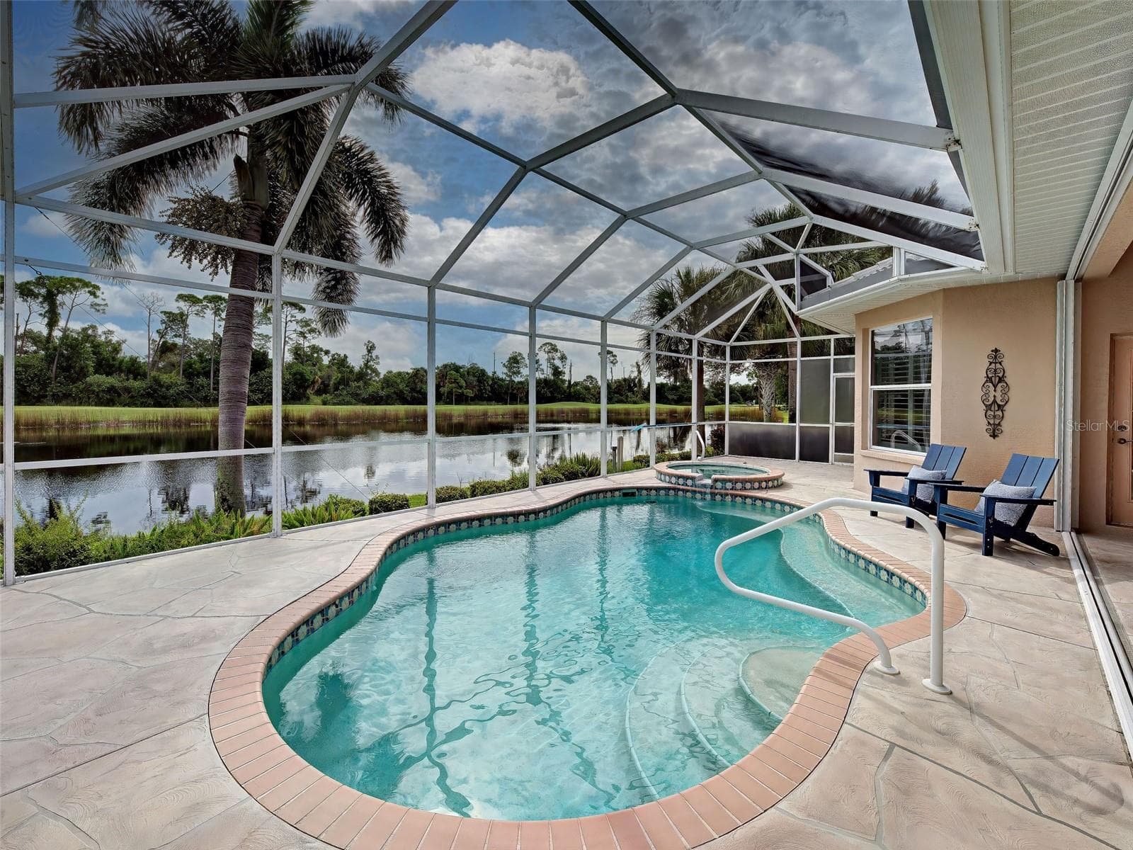 Float or relax in your private, heated pool with tranquil lake, golf and preserve views. - 692 EGRET WALK LN, VENICE