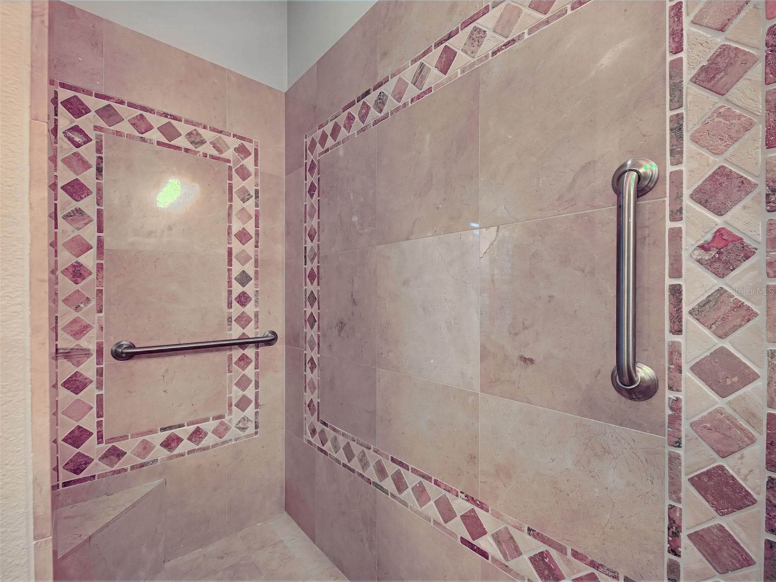 Large, tiled Roman slower with bench and grab bars. - 692 EGRET WALK LN, VENICE