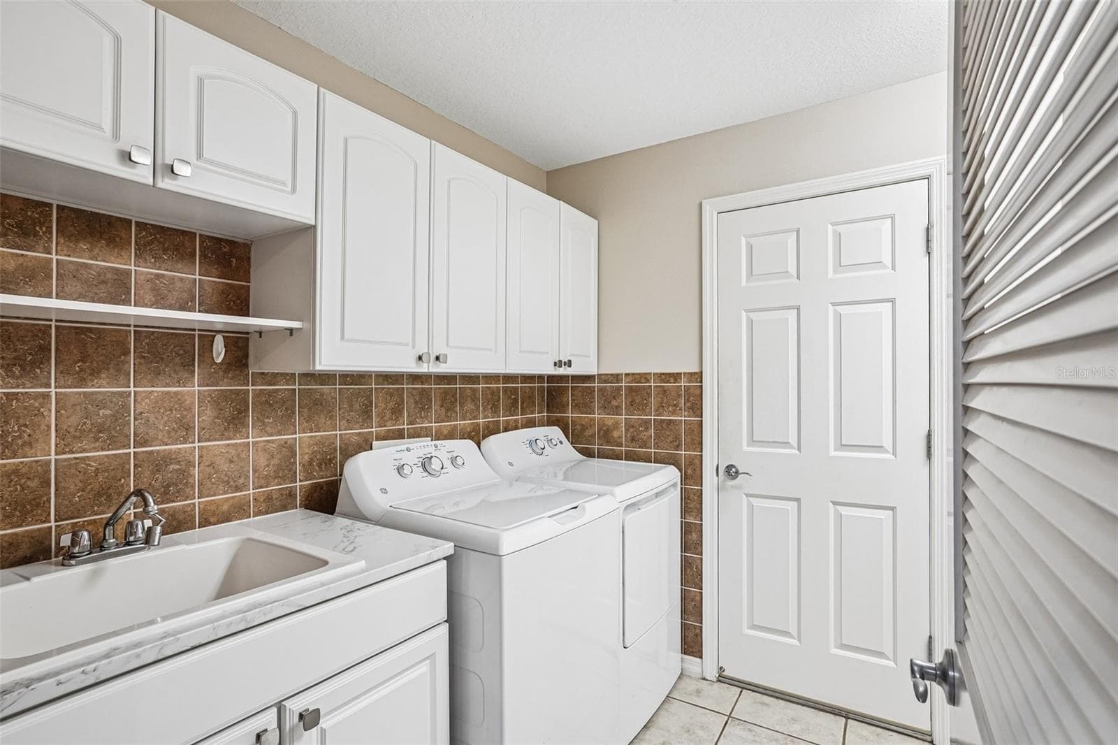 big laundry room - 17115 SE 93RD TELLFIER TER, THE VILLAGES