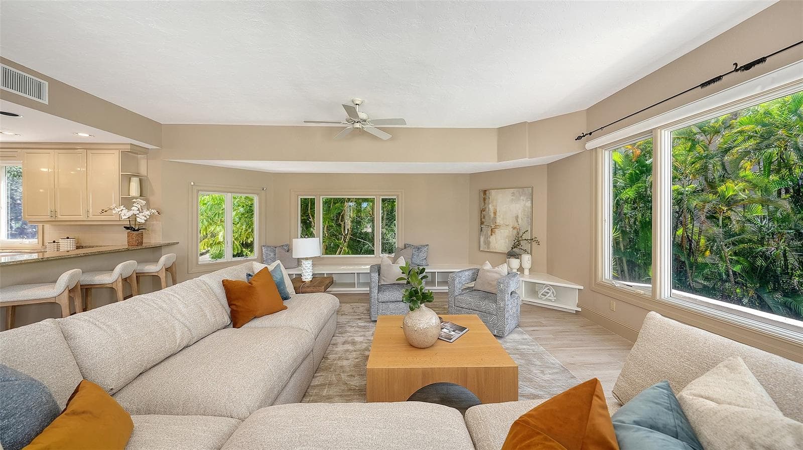 A spacious family room provides an inviting setting for everyday living while maintaining the home's sophisticated character. - 168 COASTAL HAMMOCK CT, OSPREY
