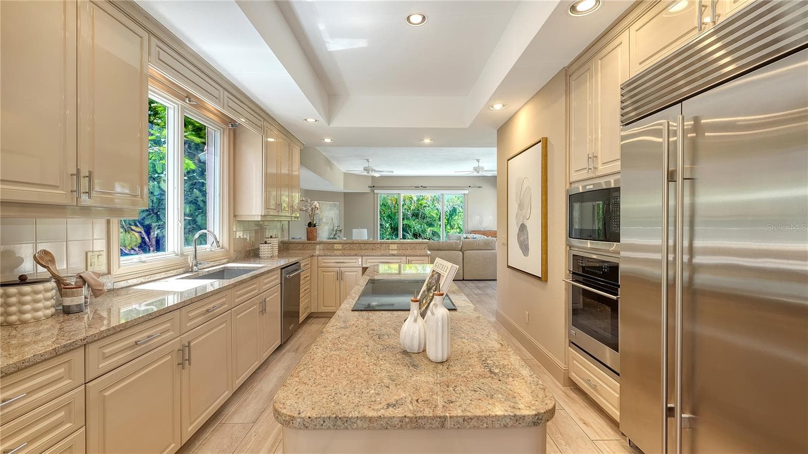Stone countertops, generous cabinetry and premium appliances combine function with timeless design. - 168 COASTAL HAMMOCK CT, OSPREY