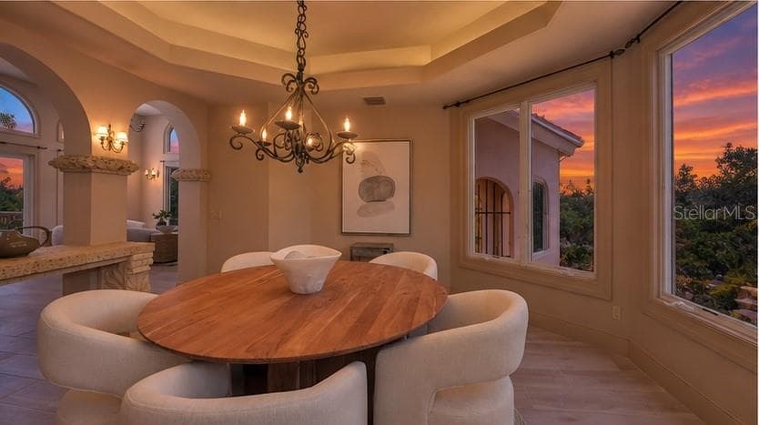 Enjoy unforgettable Florida sunsets from the elegance and comfort of the formal dining room. - 168 COASTAL HAMMOCK CT, OSPREY