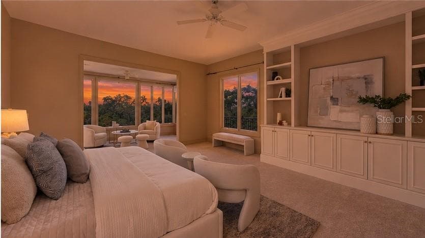 Expansive windows bring dramatic sunset colors directly into the private primary retreat. - 168 COASTAL HAMMOCK CT, OSPREY