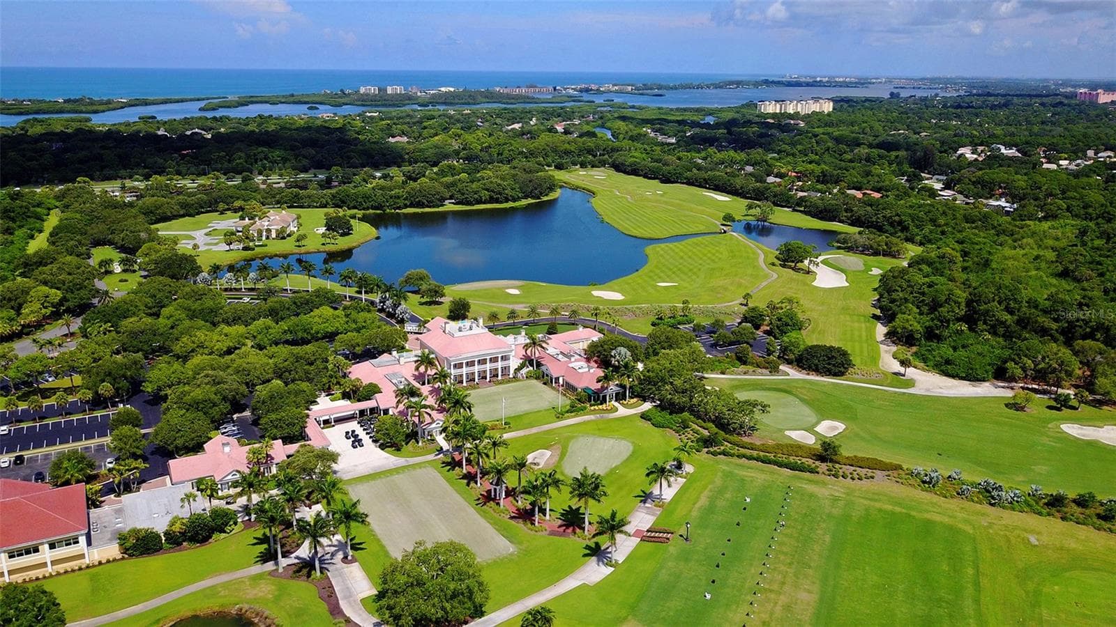 Beautifully maintained fairways and lakes showcase the exceptional golf lifestyle offered at The Oaks. - 168 COASTAL HAMMOCK CT, OSPREY