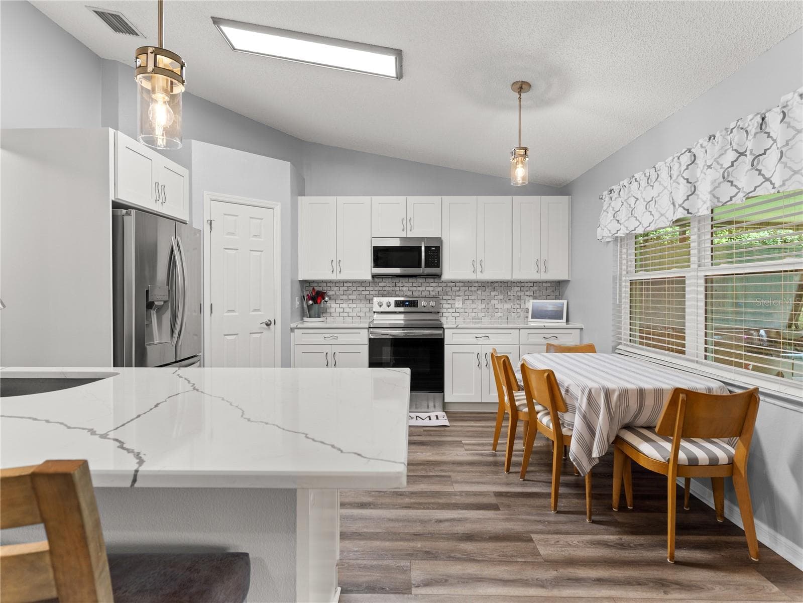 Updated kitchen with quartz countertops - 206 LONDON DR, PALM COAST