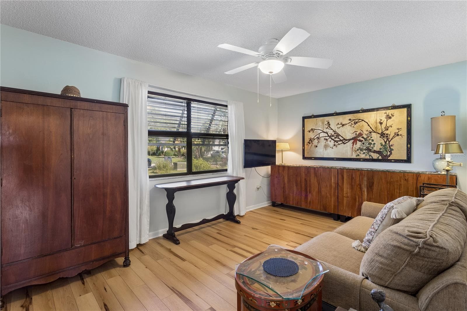 Second bedroom is currently used as a sitting and TV room - 803 DUNDEE CIR #803, LEESBURG