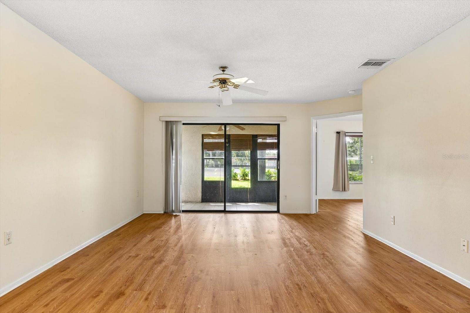 Living Room with Ceiling Fan and Sliders to Back Porch - 821 3RD AVE SW #15/7, LARGO