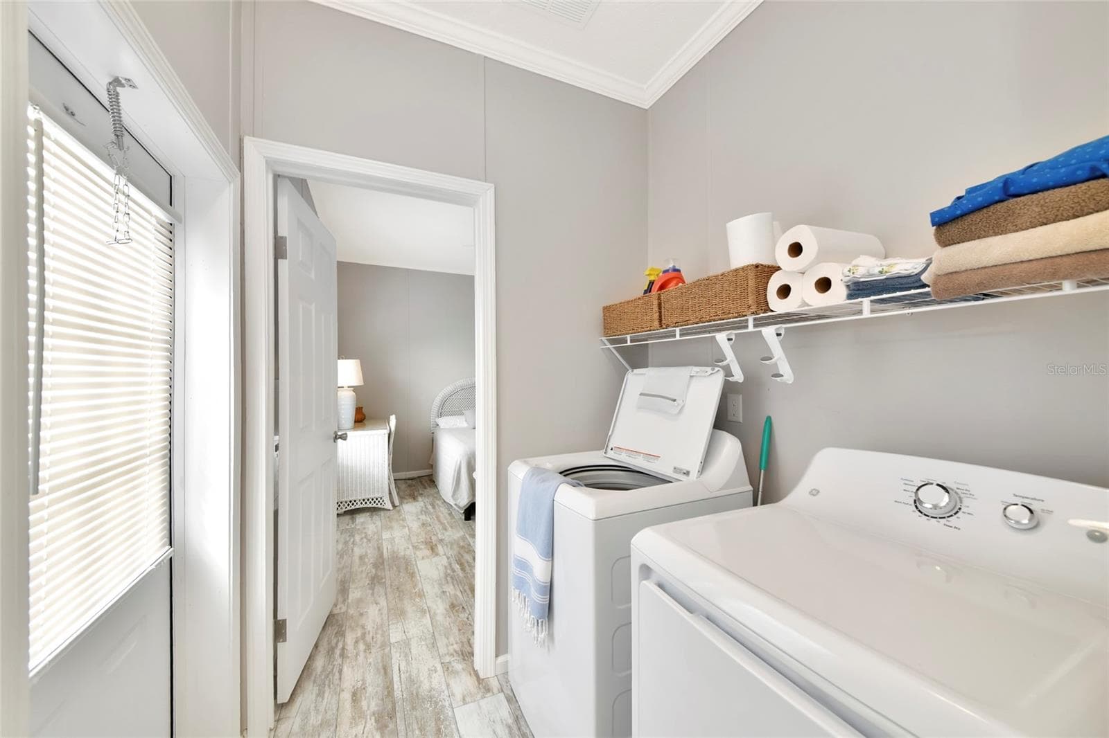 Laundry Space with built-in shelving - 6843 HIKINA DR, NORTH PORT