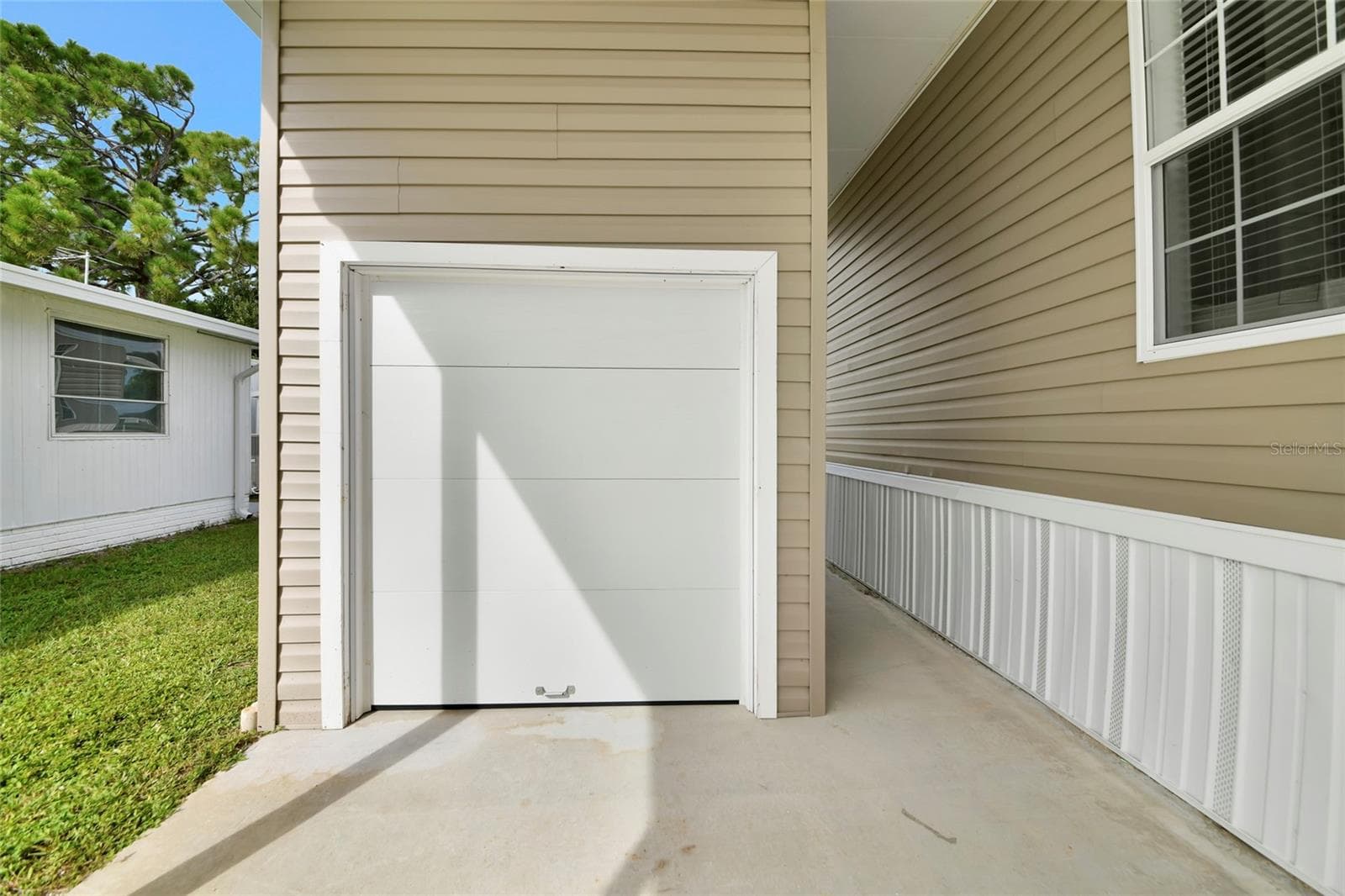Shed w/garage door for easy golf cart access - 6843 HIKINA DR, NORTH PORT