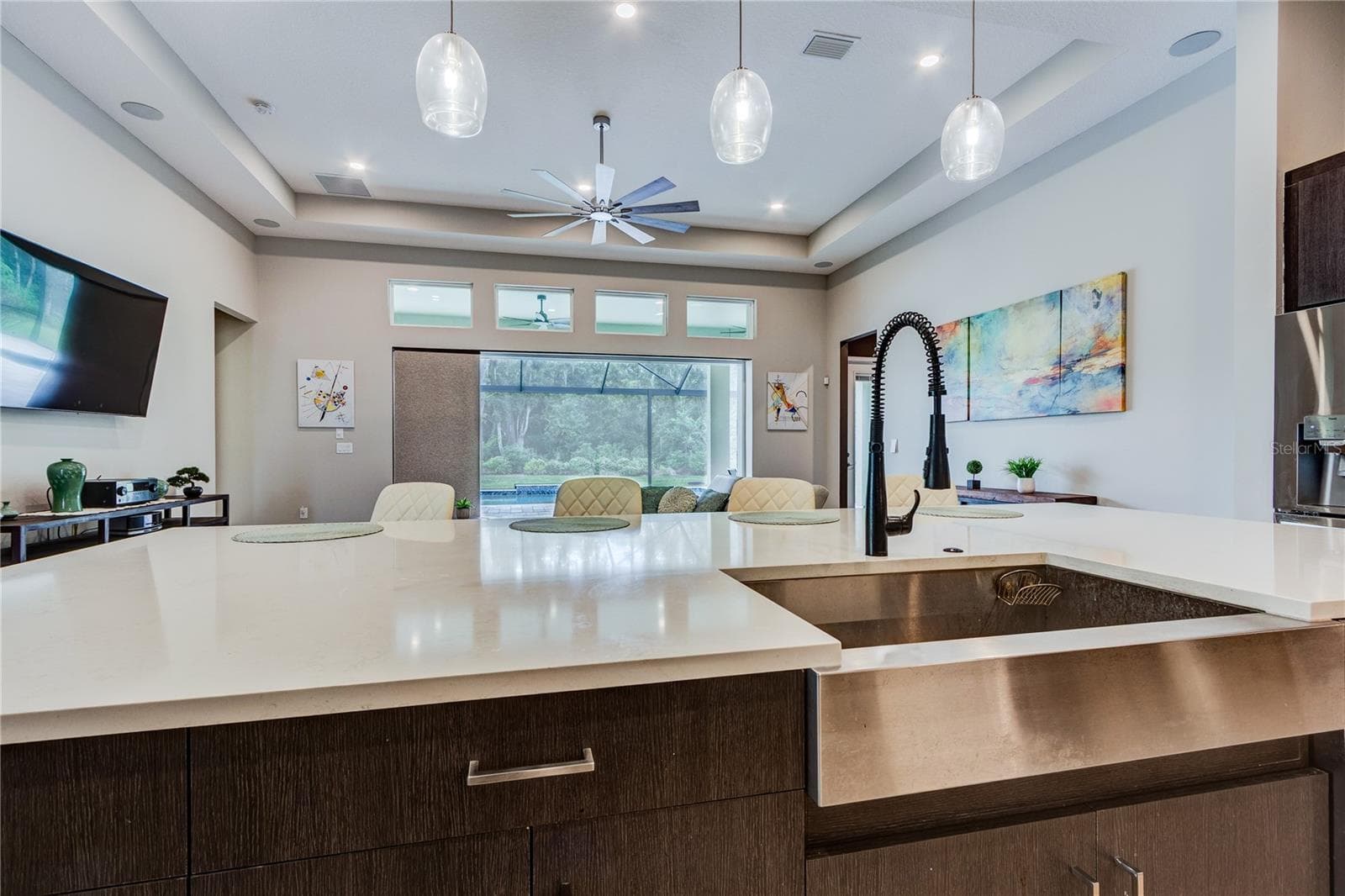 Farmhouse stainless sink in quartz center island - 13303 TRAILING MOSS DR, DADE CITY
