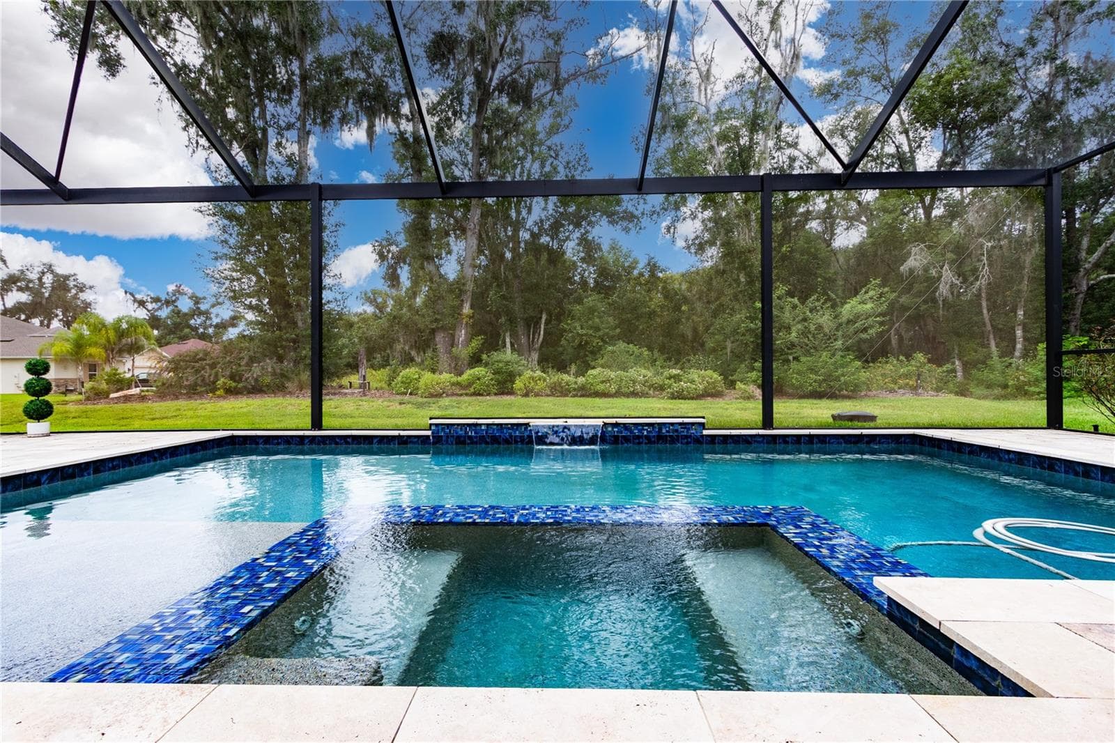 Spectacular swimming pool with spa, bubler and waterfall - 13303 TRAILING MOSS DR, DADE CITY