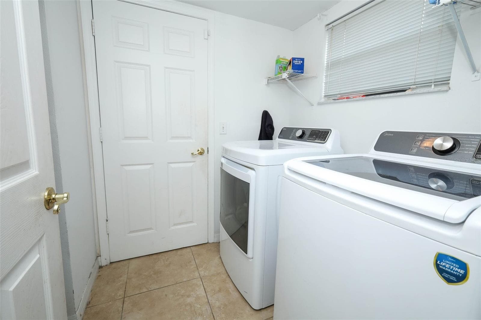 laundry room downstairs - 1000 PIEDMONT OAKS DR, APOPKA