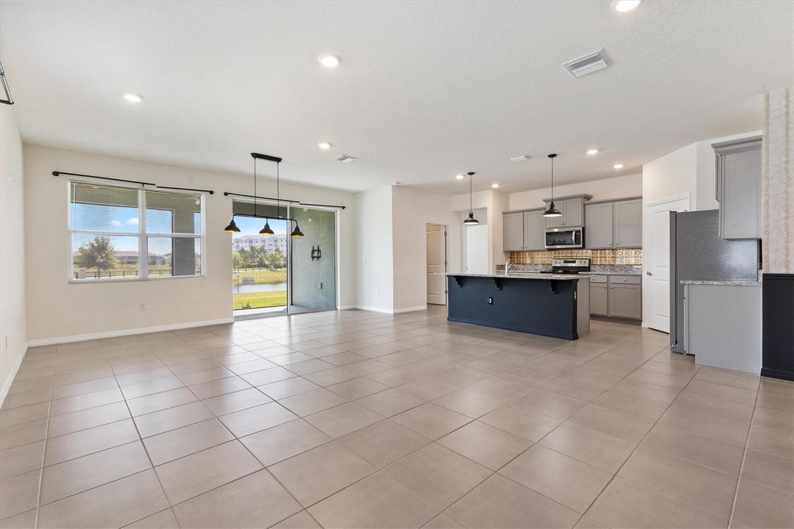 Living room/kitchen - 5043 STOKES WAY, WILDWOOD