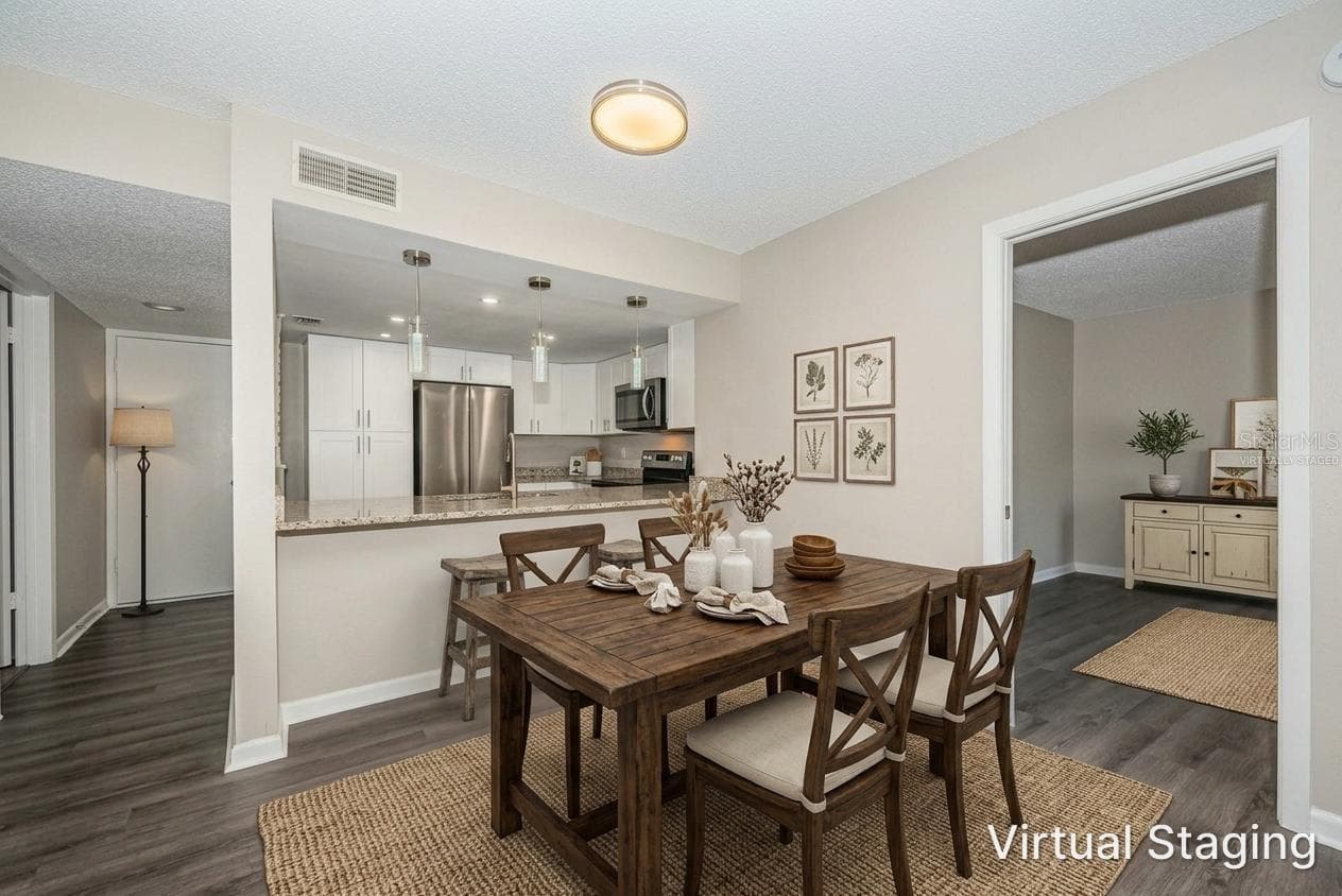 Virtually staged dining area - 2591 COUNTRYSIDE BLVD #5106, CLEARWATER