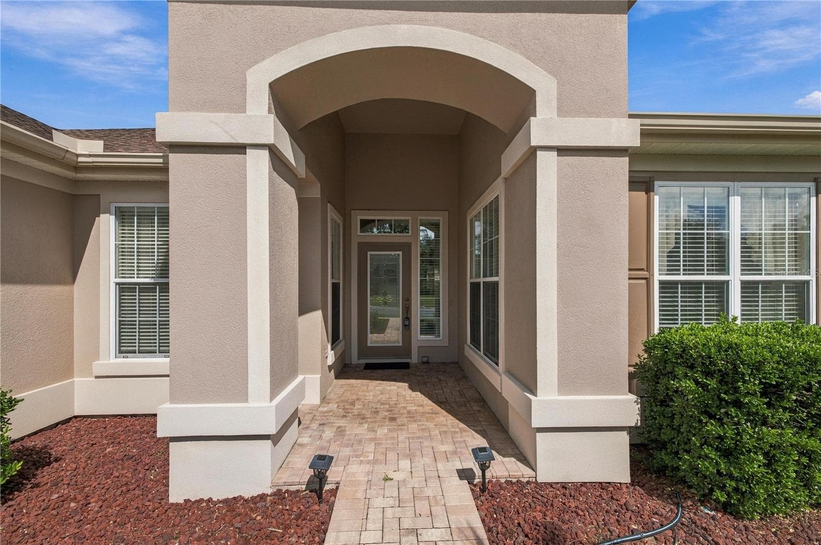 Brikc paver sidewalk with leaded glass front door! - 9495 SE 130TH PLACE RD, SUMMERFIELD