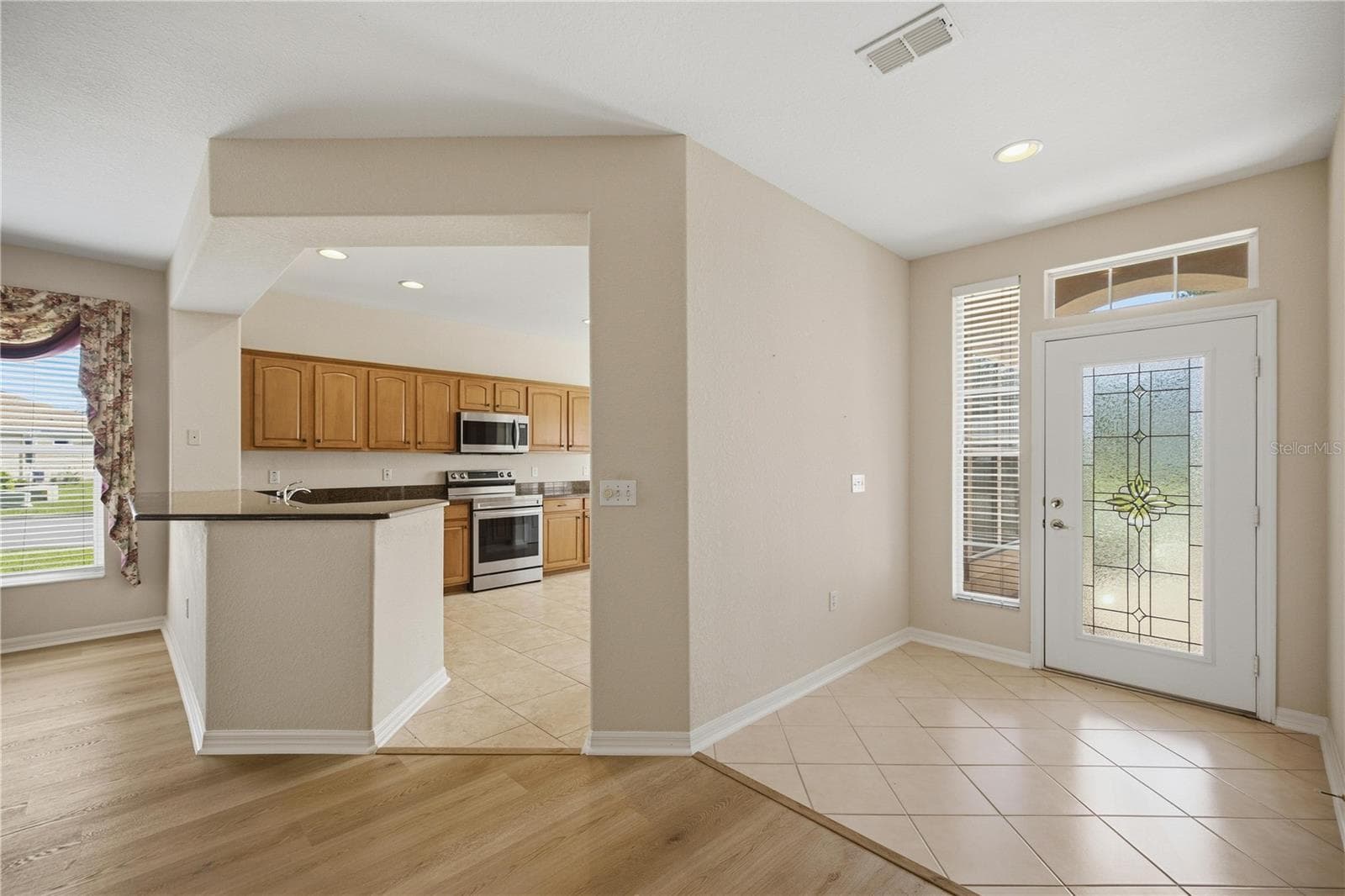 View from living room of kitchen and foyer! - 9495 SE 130TH PLACE RD, SUMMERFIELD